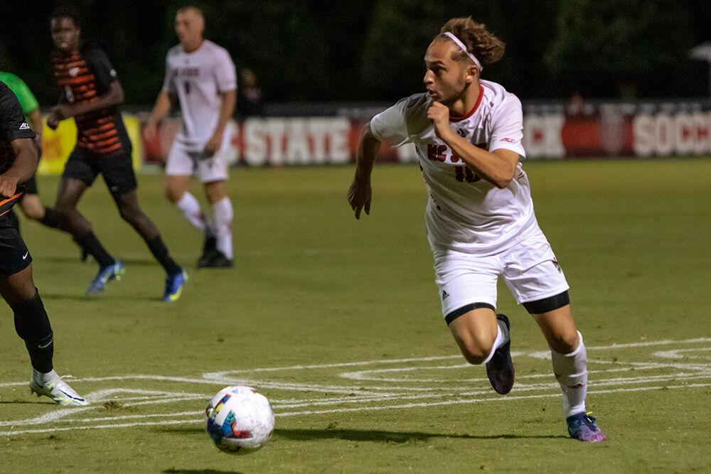 Sophomore midfielder Noe Cabezas runs the ball down the field during the match against Virginia Tech on Friday, Sept. 23, 2022 at Dail Soccer Field. Cabezas had two shot attempts over the course of the game. NC State beat Virginia Tech 1-0.