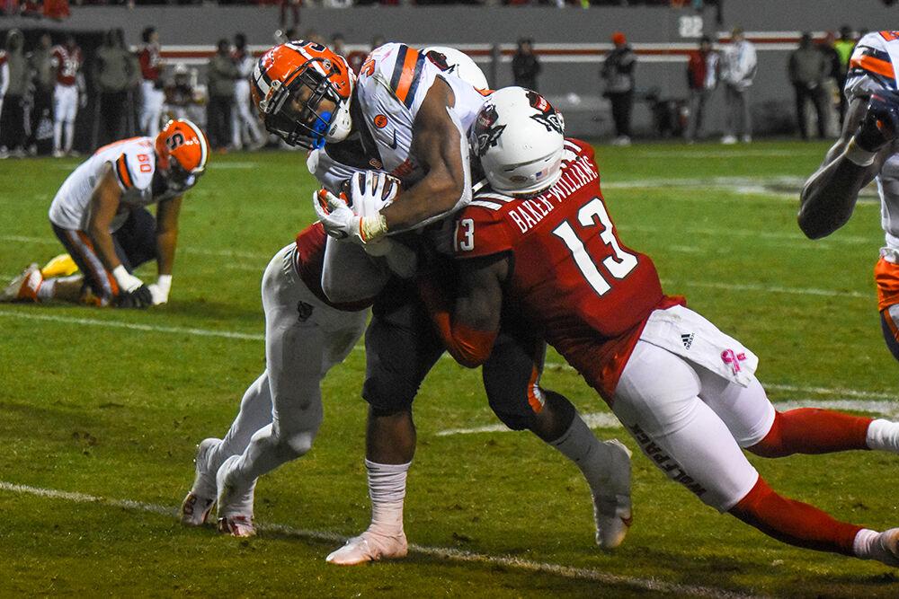 Junior nickelback Tyler Baker-Williams completes a tackle during the Wolfpack's home game against the Syracuse Orange at Carter-Finely Stadium on Nov 20, 2021. The Wolfpack won 41-17.