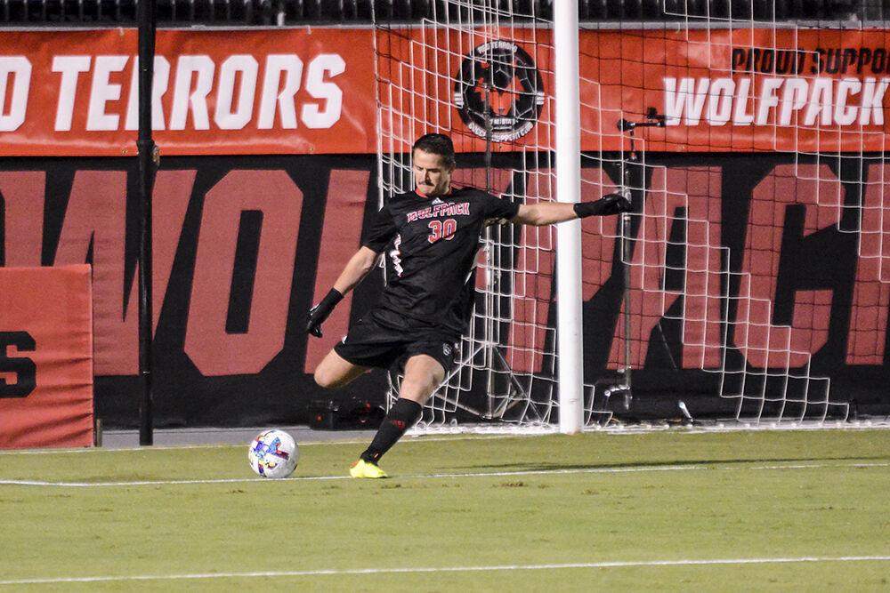 Senior goalkeeper Windham Ellis performs a goal kick during the match against James Madison on Tuesday, Sept. 13, 2022 at Dail Soccer Field. Ellis had five saves for the Wolfpack. NC State lost 1-0 to James Madison.