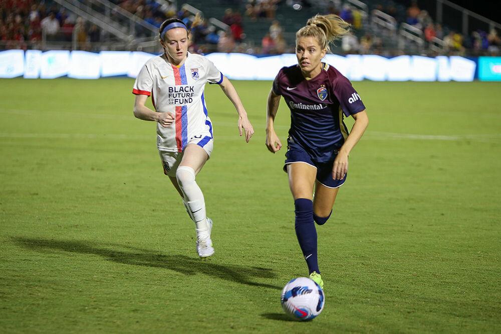 Courage midfielder Denise O'Sullivan outruns Reign midfielder Rose Lavelle during the NC Courage match against OL Reign on Friday, Sept. 17, 2022. OL Reign won the match 2-1.