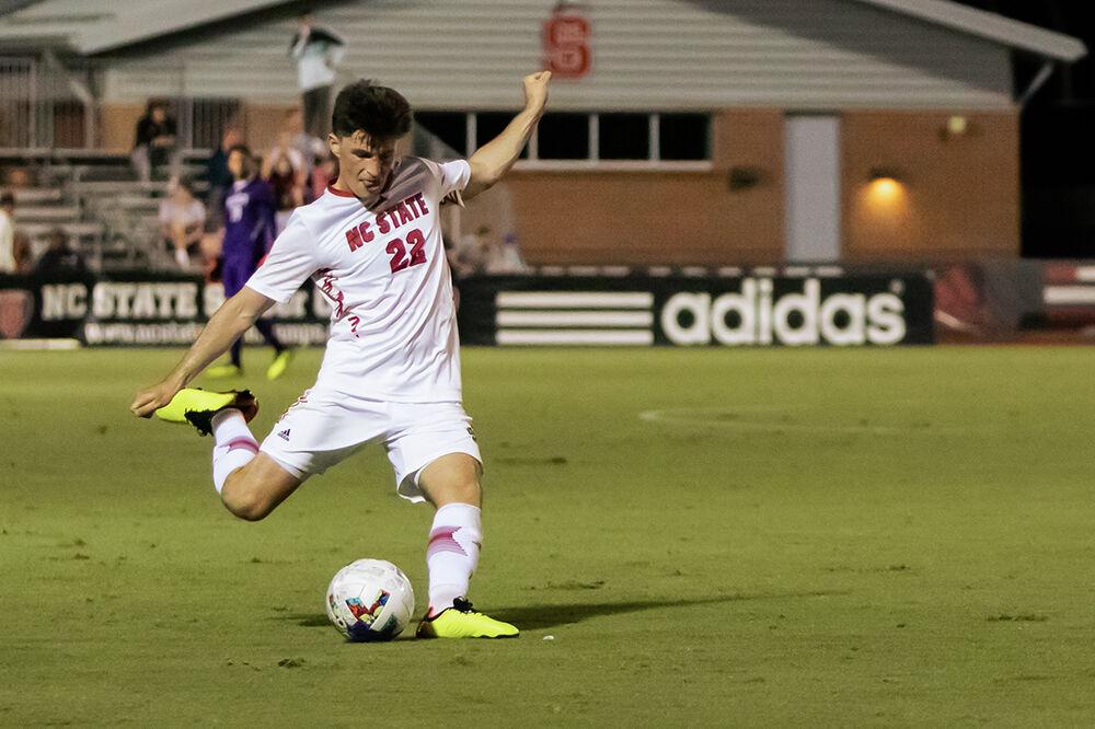 Graduate student midfielder Conor Kelly kicks the ball downfield during the match against Virginia Tech on Friday, Sept. 23, 2022 at Dail Soccer Field. Kelly finished the game with one assist, one shot on the goal, and two shot attempts. NC State beat Virginia Tech 1-0.