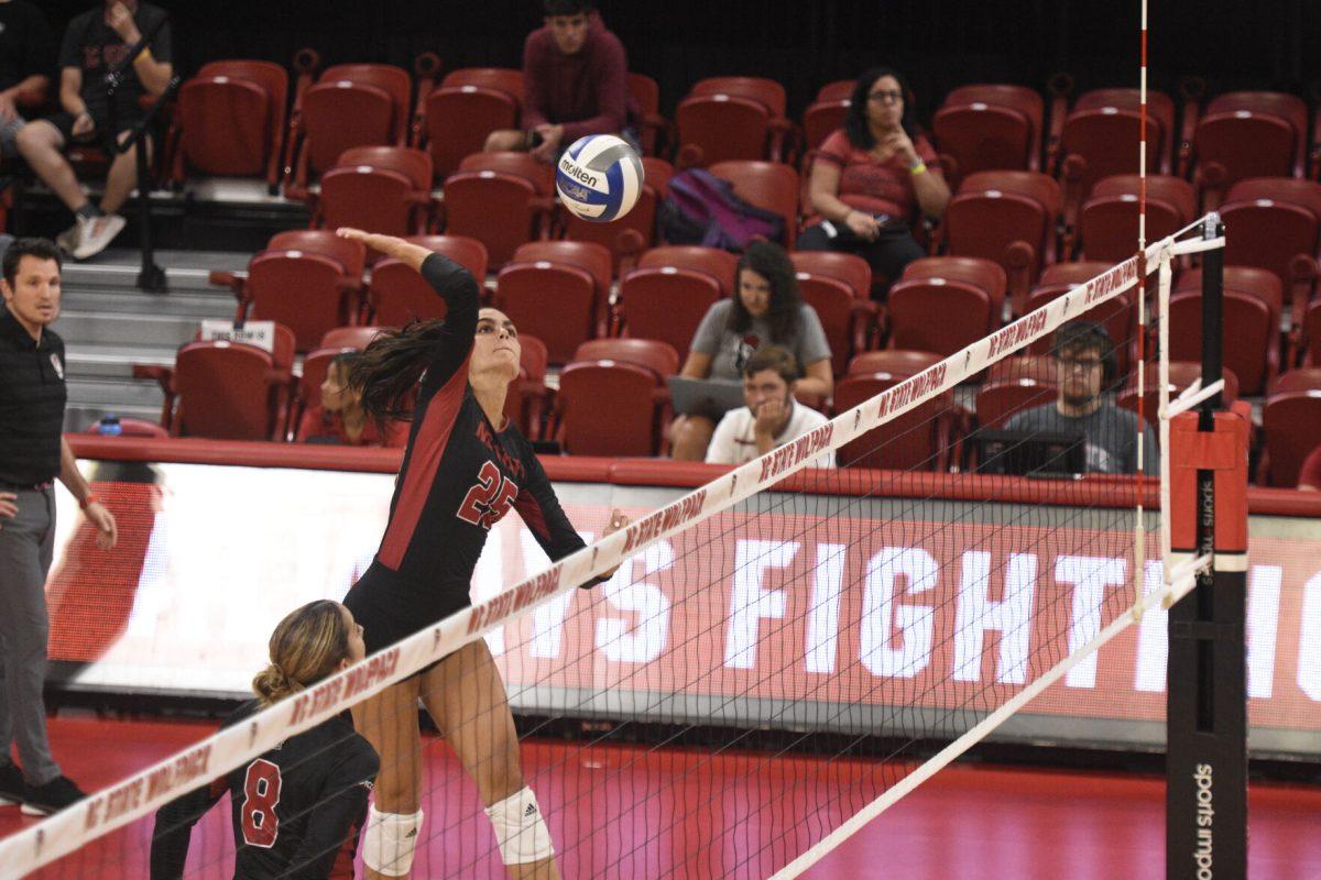 Junior middle blocker Riley Shaak spikes a ball versus WCU on Friday, Sept. 9, 2022 in Reynolds Coliseum. Shaak had three kills during NC State&#8217;s 3-0 loss to the Catamounts.
