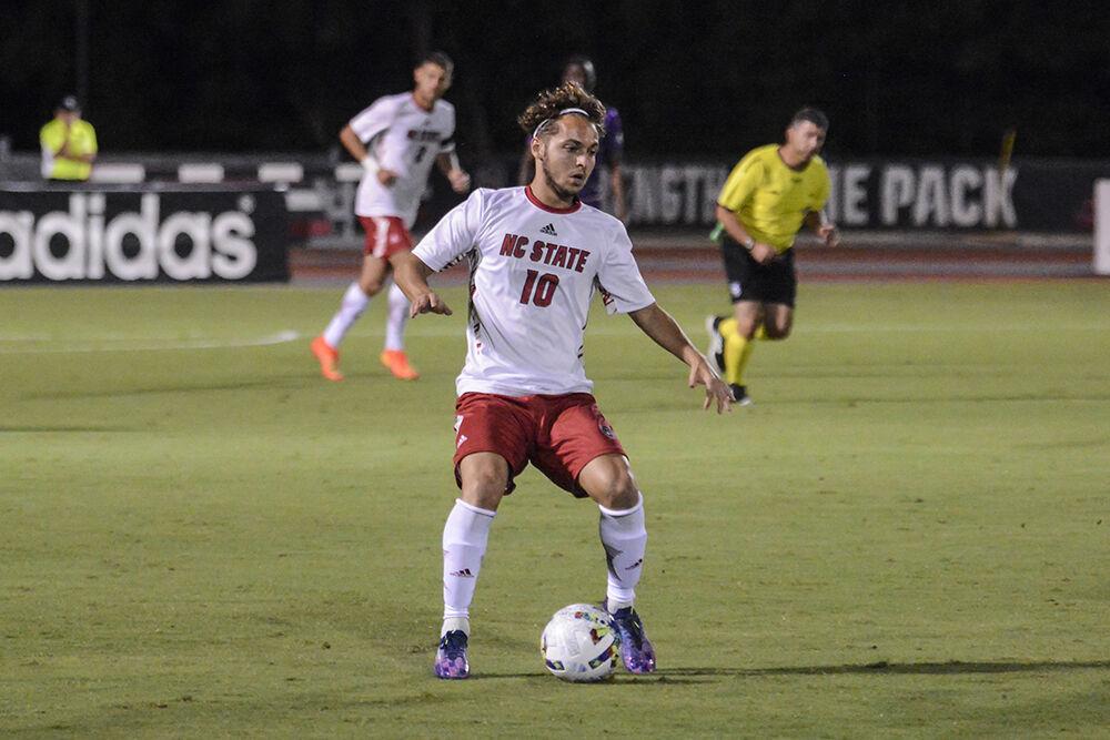 Sophomore midfielder Noe Cabezas dribbles the ball during the match against James Madison on Tuesday, Sept. 13, 2022 at Dail Soccer Field. NC State lost 1-0 to James Madison.