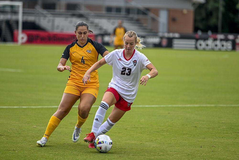 Senior forward Alexis Strickland kicks the ball during the match against VCU on Sunday, Aug. 21, 2022 at Dail Soccer Field. NC State beat VCU 2-1.
