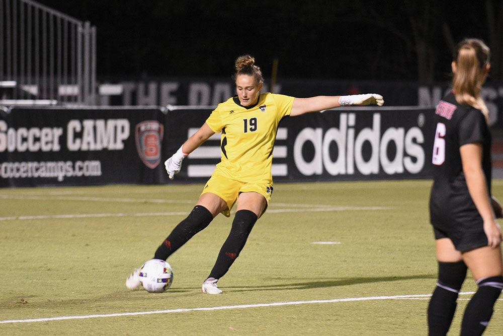 Junior goalkeeper Maria Echezarreta kicks the ball out of the goalie's box after a save during the match against the Blue Devils at Dail Soccer Field on Sunday, Sept. 25, 2022. Echezarreta had five saves. NC State lost 6-0.
