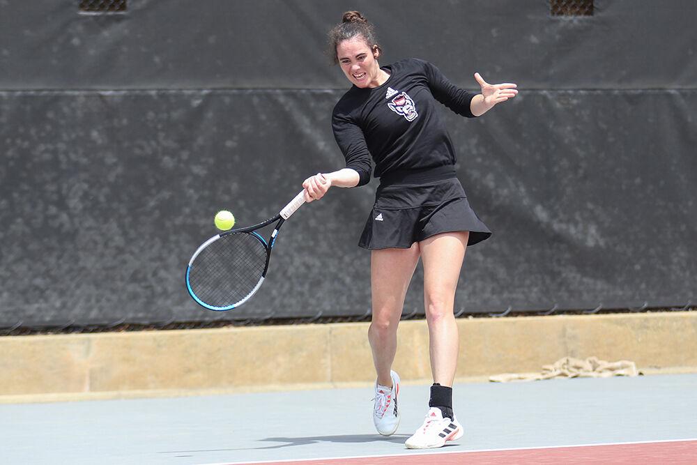 Senior Nell Miller returns the ball to Notre Dame during the match on Saturday, April 16, 2022 at J.W. Isenhour Tennis Center. Miller won her singles match and helped lead to a Wolfpack win of 7-0.