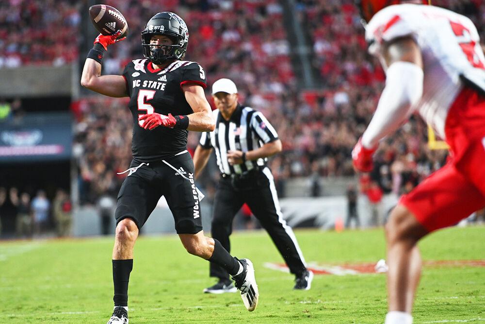 Graduate student wide receiver Thayer Thomas passes the ball into the end zone in the game against the Texas Tech Red Raiders at Carter-Finley Stadium on Saturday, Sept. 17, 2022. Thomas had four receptions for 30 yards with one touchdown. The Wolfpack won 27-14.