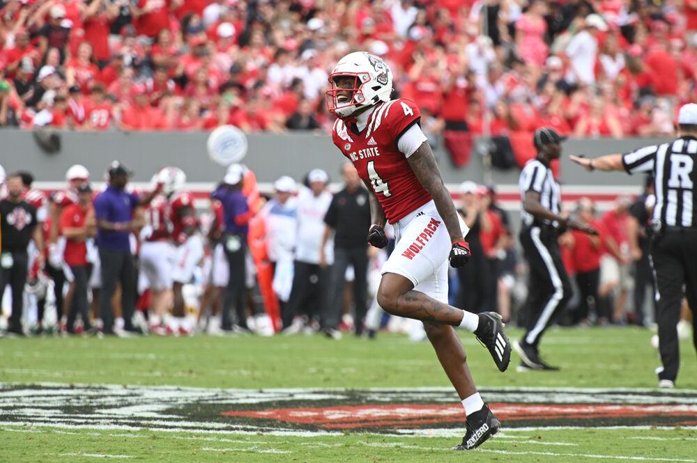 Graduate safety Cyrus Fagan celebrates a defensive stop during the Wolfpack's home football game against the Charleston Southern Buccaneers at Carter-Finley Stadium on Saturday, Sept. 10, 2022. The Wolfpack beat the Buccaneers 55-3.