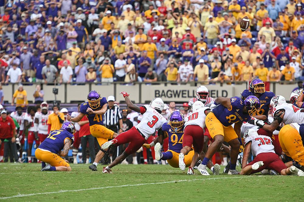 The NC State special teams collapses on the East Carolina kicker as he misses wide right on a 41-yard kick during the Wolfpack's football game at Dowdy-Ficklen Stadium on Saturday, Sept. 3, 2022. The Wolfpack beat the Pirates 21-20.