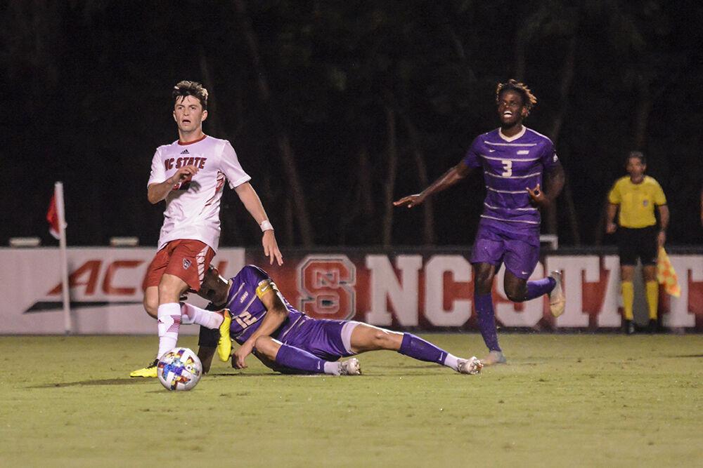 Graduate midfielder Conor Kelly passes the ball during the match against James Madison on Tuesday, Sept. 13, 2022 at Dail Soccer Field. Kelly had two shot attempts. NC State lost 1-0 to James Madison.