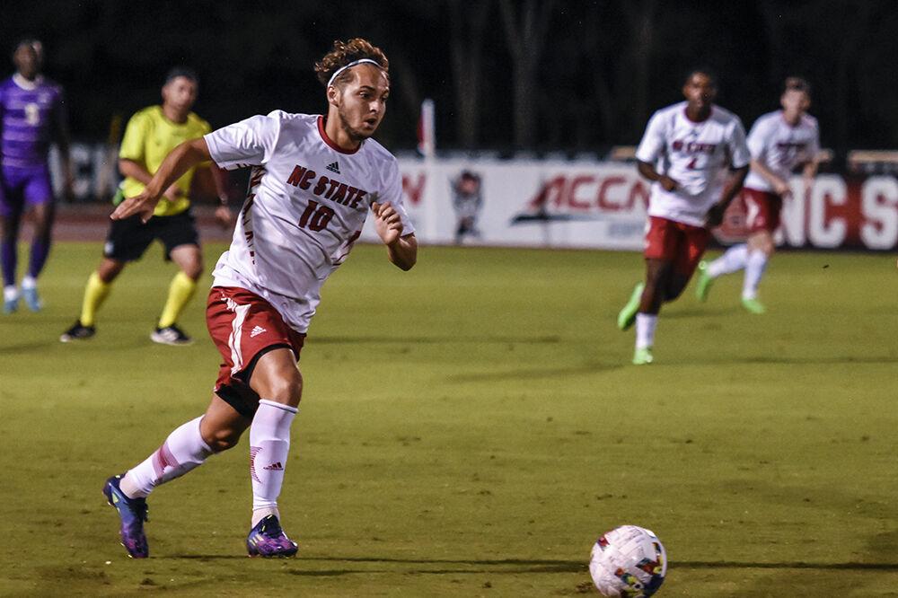 Sophomore midfielder Noe Cabezas dribbles the ball down the field during the match against James Madison on Tuesday, Sept. 13, 2022 at Dail Soccer Field. NC State lost 1-0 to James Madison.