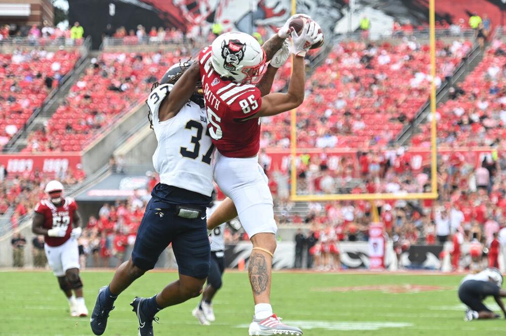 Sophomore wide reciever Anthony Smith catches a pass against the sideline during the Wolfpack's home football game against the Charleston Southern Buccaneers at Carter-Finley Stadium on Saturday, Sept. 10, 2022. Smith had a total of 78 yards receiving including a 40 yard touchdown catch. The Wolfpack beat the Buccaneers 55-3.