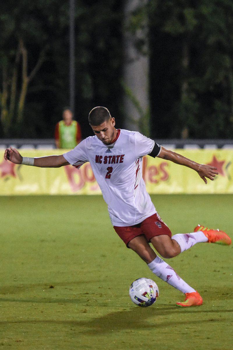 Senior defender Pablo Pedregosa passes the ball during the match against James Madison on Tuesday, Sept. 13, 2022 at Dail Soccer Field. NC State lost 1-0 to James Madison.