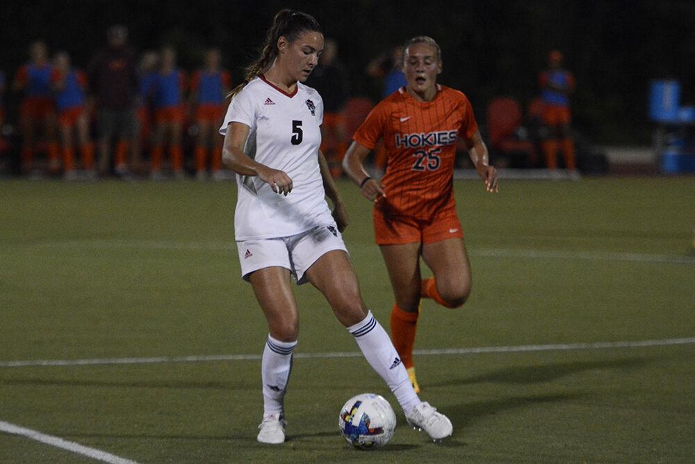 Graduate defender Jenna Butler dribbles the ball during the match against Virginia Tech on Thursday, Sept. 22, 2022 at Dail Soccer Field. NC State lost 1-0.