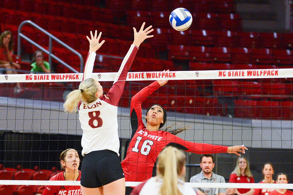 Sophomore middle blocker Jada Allen jumps for a spike in the game against Elon on Saturday, Sept. 3, 2022 in Reynolds Coliseum. Jada had three kills, one block assist and one solo block during the game. NC State won 3-1 against Elon.