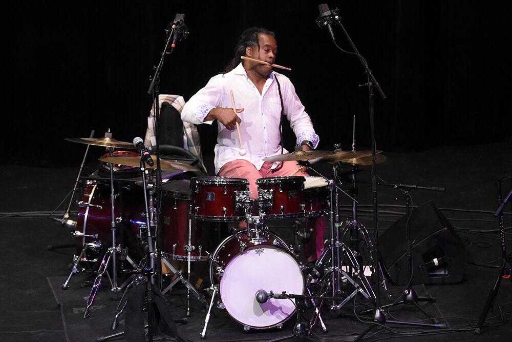Ranky Tanky drummer Quentin Baxter drums with a drumstick in his mouth on Thursday, Sept. 29, 2022 in Stewart Theatre. The Grammy award winning band performed with special guest Lisa Fischer.