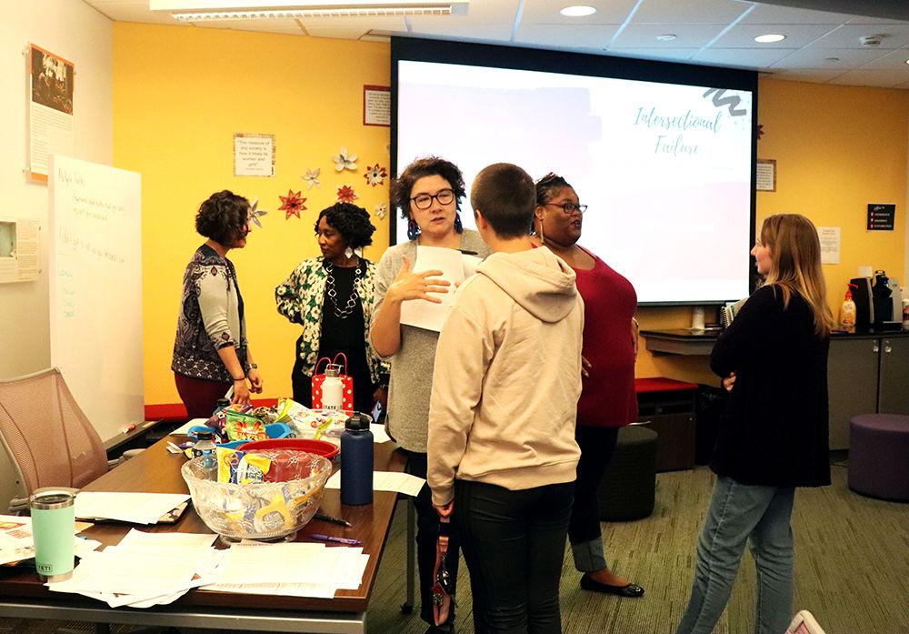 Students and staff talk after a presentation on inter-sectional failure in the Women's Center at NC State on Oct. 18, 2019. The Women's Center held the Love Your Body Day Summit and brought up topics with revolutionizing all bodies and had guest speakers from the Multicultural Student Affairs, Women's and GLBT Center.