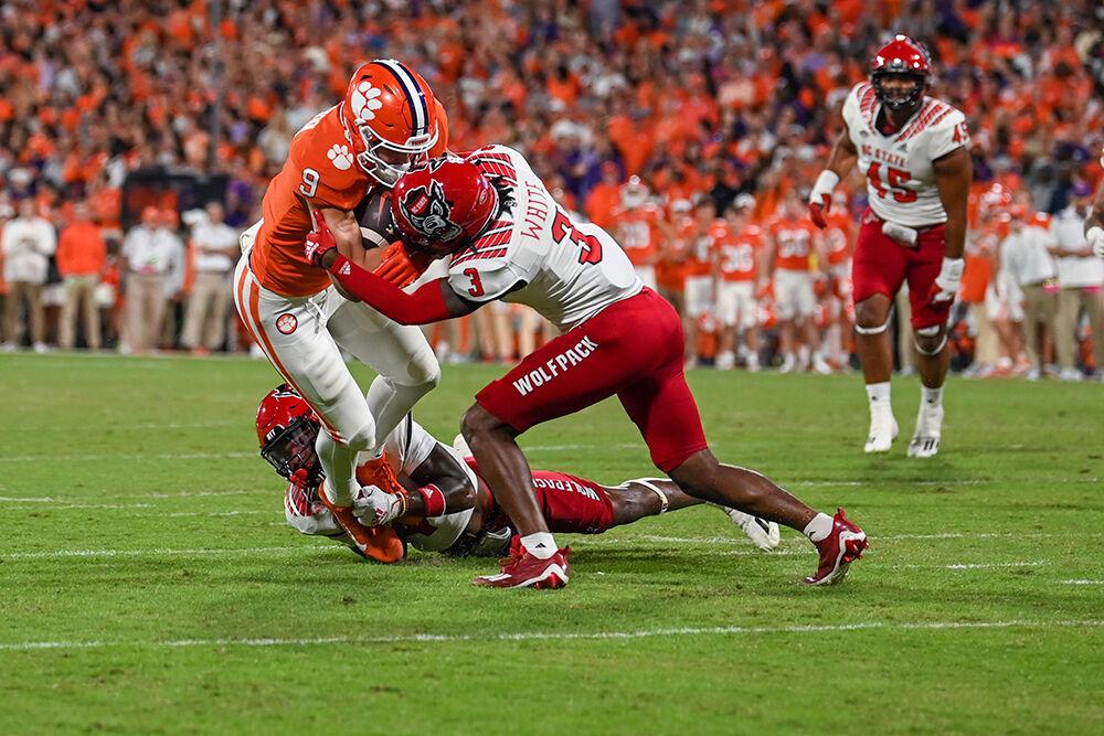 Sophomore cornerback Aydan White tackles the ball carrier during the game against Clemson on Saturday, Oct. 1, 2022 at Clemson Memorial Stadium. White had two total tackles during the game. NC State lost to Clemson 30-20.