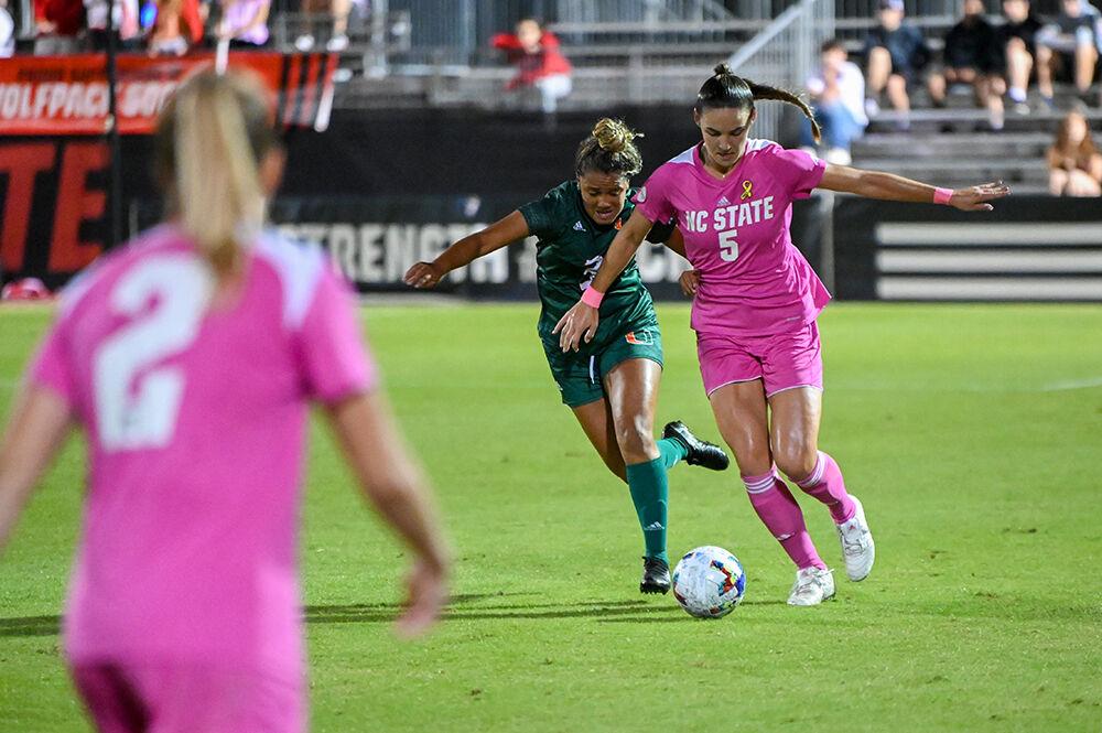 Graduate defender Jenna Butler keeps control of the ball in the match against Miami on Saturday, Oct. 15, 2022 at Dail Soccer Field. NC State tied the match with Miami 3-3.