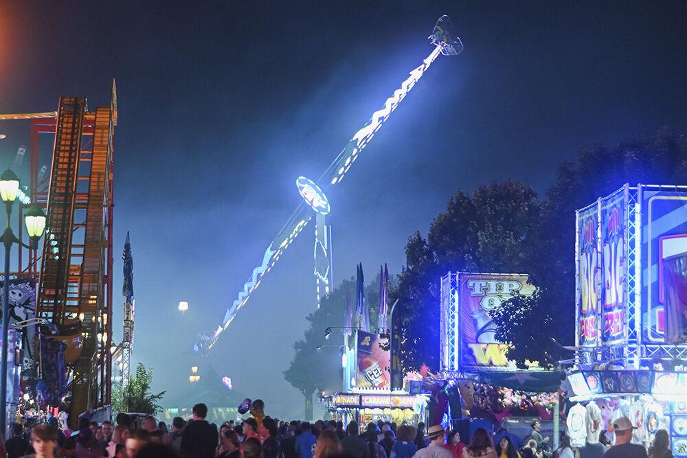 Fair Attendees ride Air Raid at the North Carolina State Fair in Raleigh, on Thursday, Oct. 13, 2022. The NC State Fair was held Oct. 13-23.