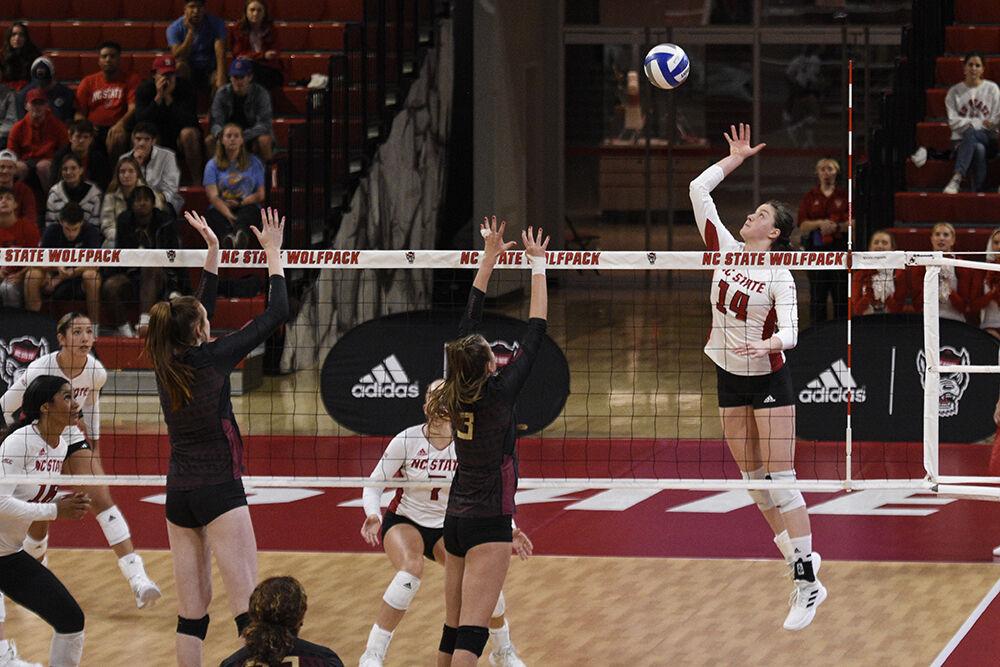 Sophomore open hitter Martyna Leoniak spikes the ball during the game against Florida State on Friday, Sept. 30, 2022 in Reynolds Coliseum. Leoniak made 11 kills throughout the game. NC State won the game 3-0.