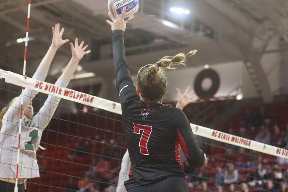 Freshman outside hitter Ava Brizard spikes the ball during the match against Miami on Sunday, Oct. 2, 2022 in Reynolds Coliseum. Brizard had 15 kills in the game. The NC State Wolfpack beat the Miami Hurricanes 3-1.