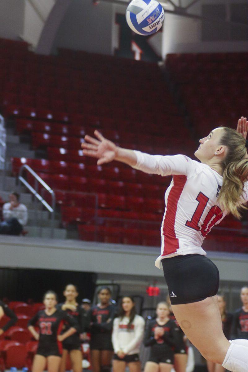 Graduate libero Priscilla Hernandez spikes the ball during the match against Miami on Sunday,&#160;Oct. 2, 2022 in Reynolds Coliseum. Hernandez had 20 digs and 10 assists in the game. The NC State Wolfpack beat the Miami Hurricanes, winning 3-1.&#160;
