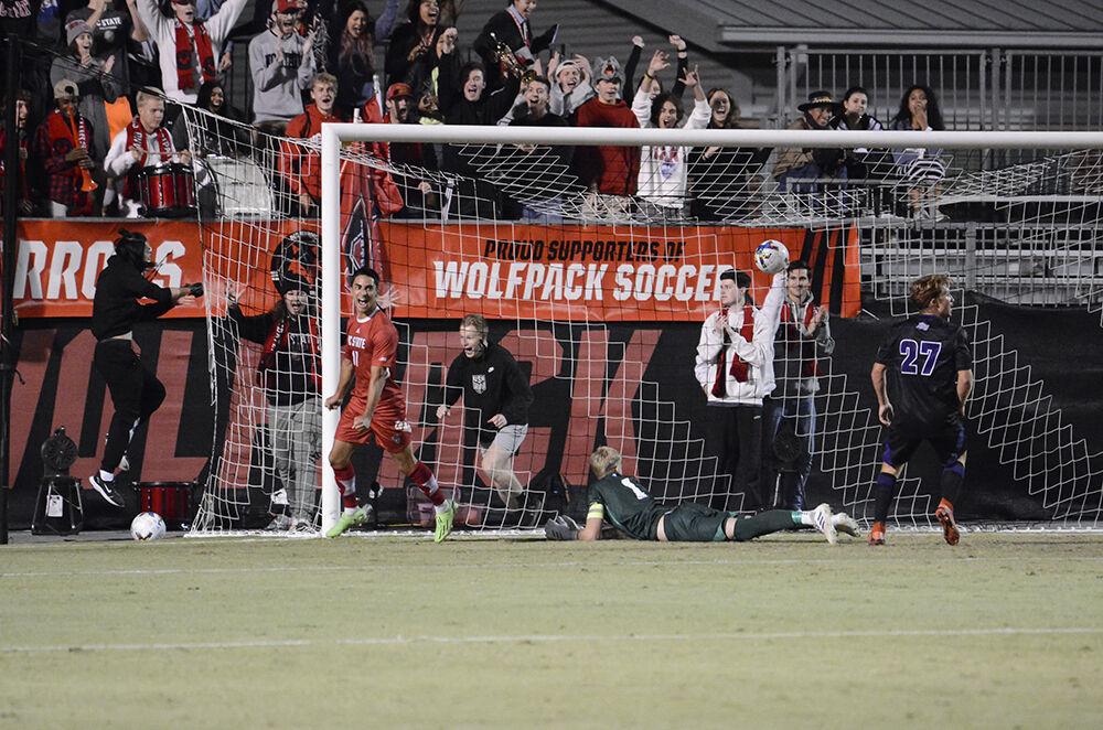 Sophomore forward Henrique Santos scores a goal during the match against High Point University on Tuesday, Oct. 4, 2022 at Dail Soccer Field. Santos made a shot on goal for the Wolfpack. NC State beat High Point University 2-0.