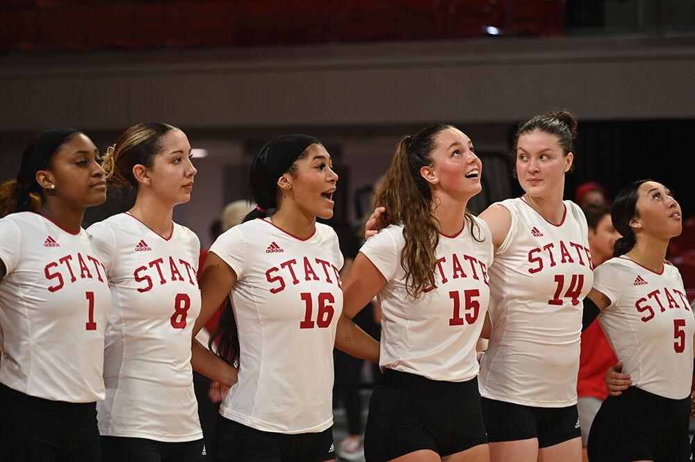The NC State volleyball team sings the alma mater at the end of the game against Clemson on Friday, Oct. 28, 2022 in Reynolds Coliseum.