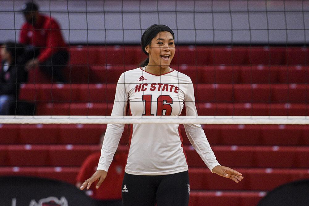 Sophomore middle blocker Jada Allen smiles in celebration during the game against Florida State on Friday, Sept. 30, 2022 in Reynolds Coliseum. Allen had four kills throughout the game. NC State won the game 3-0.