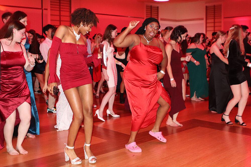 (Left) Hannah Williams, a third-year studying communications and Zania Sanders, a first-year studying biological science, dance the Cupid Shuffle at the Red and White Ball in Talley Student Union on Saturday, Oct. 22, 2022.