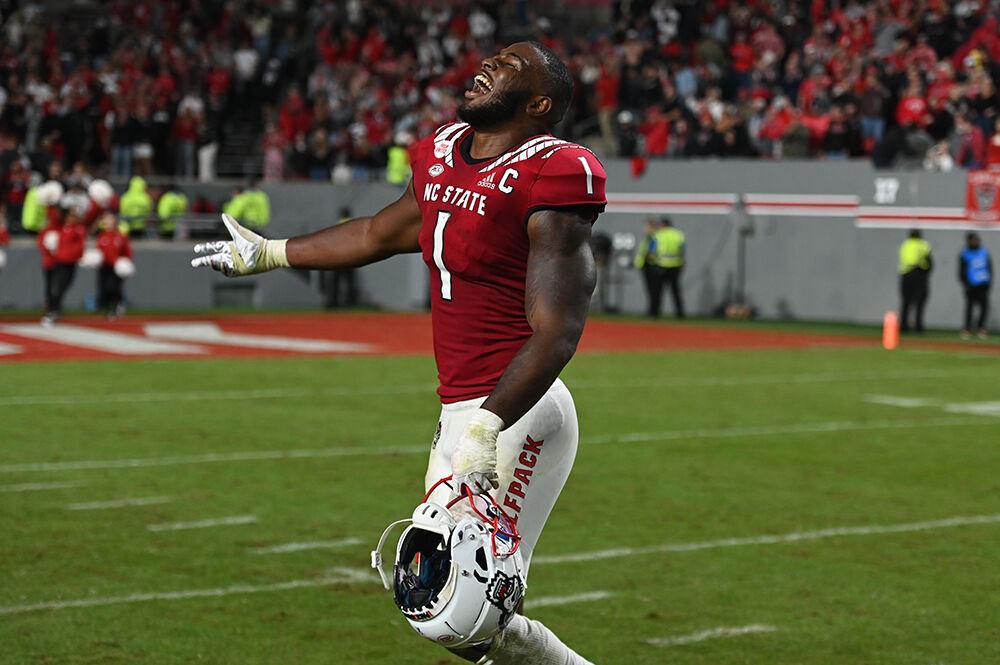 Graduate linebacker Isaiah Moore celebrates on the field after the Wolfpack's home football game against the Florida State Seminoles on Saturday, Oct. 8, 2022 at Carter-Finley Stadium. The Wolfpack beat the Seminoles 19-17.