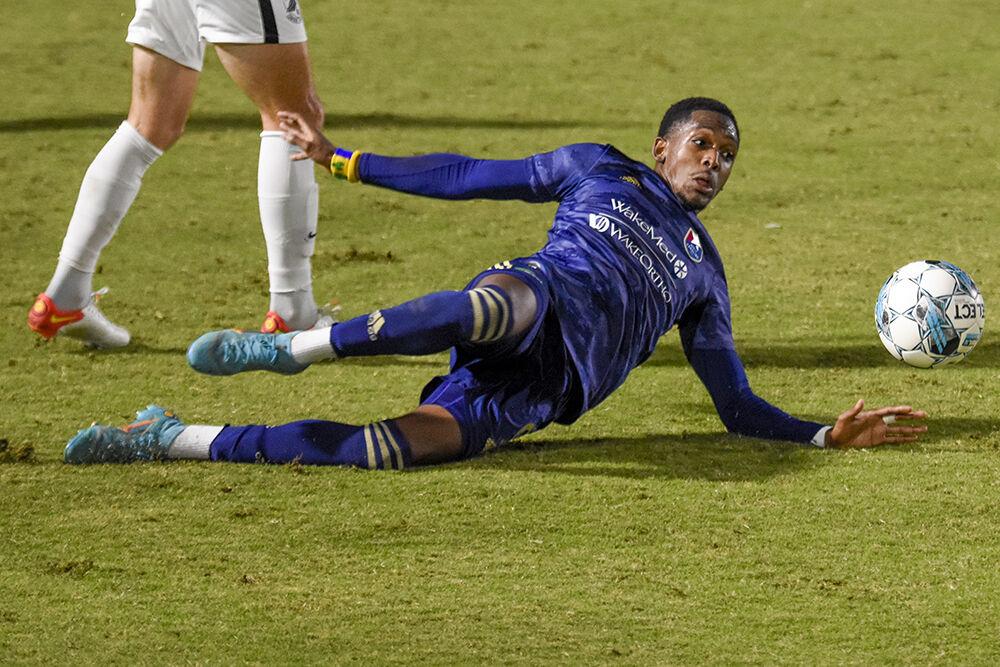 NCFC forward Oalex Anderson slides after the ball during the match against Union Omaha on Saturday, Oct. 1, 2022 in Sahlen's Stadium at WakeMed Soccer Park. Anderson made 20 passes and won 12 duels. NCFC tied the match 1-1.