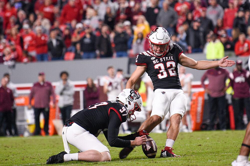 Junior linebacker Drake Thomas kicks a field goal during the Wolfpack's game against the Virginia Tech Hokies on Thursday, Oct. 27, 2022 at Carter-Finley Stadium. The Wolfpack beat the Hokies 22-21.