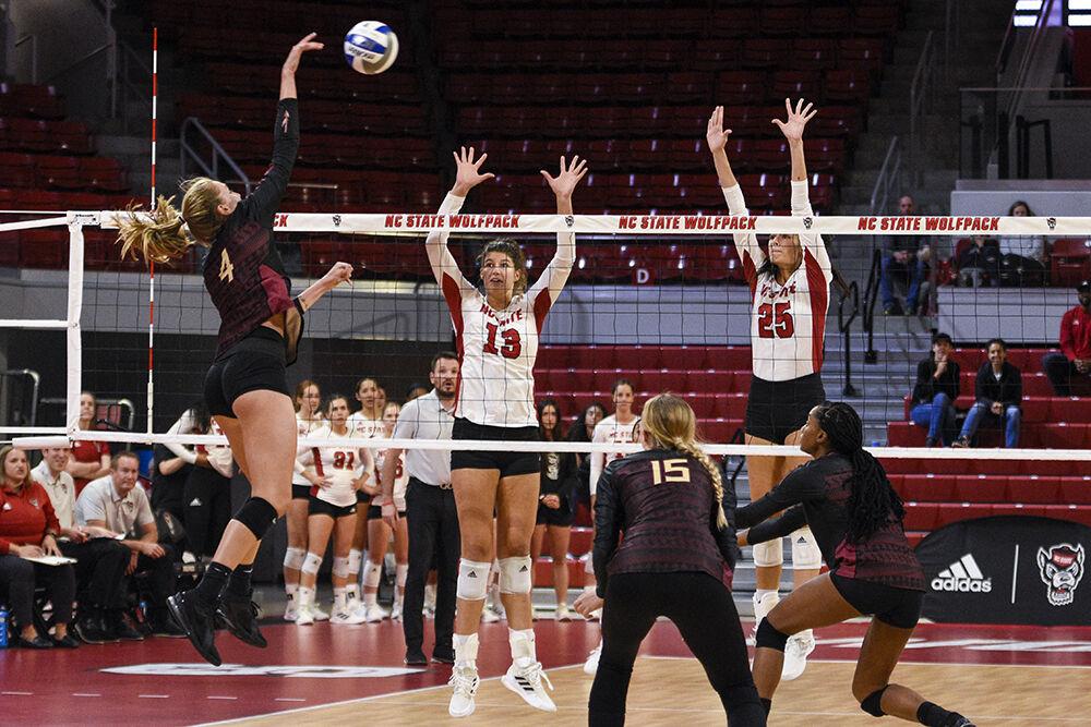 Graduate opposite hitter Vanja Bukilic, left, and junior middle blocker Riley Shaak, right, block the ball during the game against Florida State on Friday, Sept. 30, 2022 in Reynolds Coliseum. Bukilic had six kills throughout the game. NC State won the game 3-0.