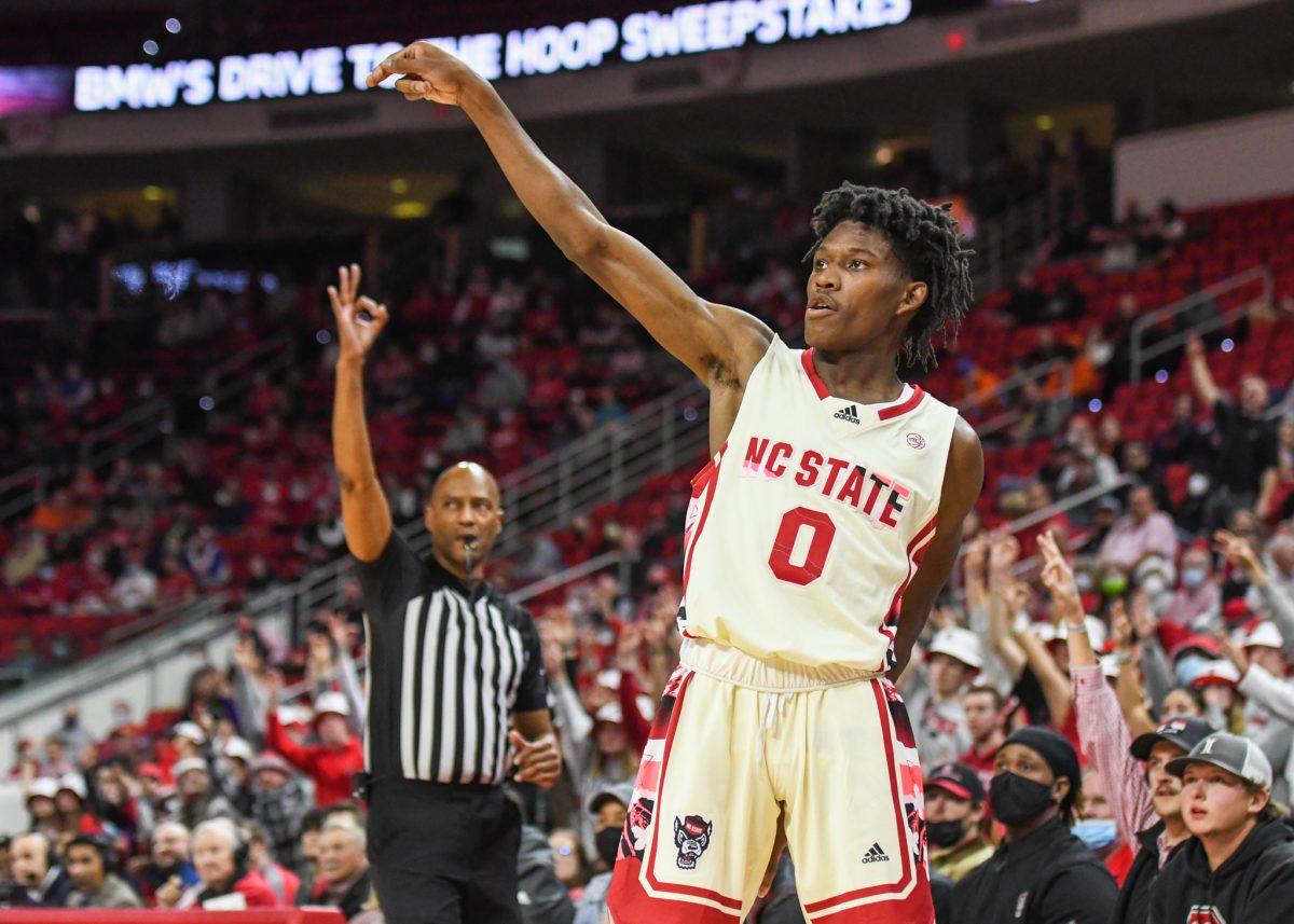 Freshman guard Terquavion Smith watches his three-point shot go in during the game versus the Syracuse Orange on Wednesday, Feb. 2, 2022 in PNC Arena. Smith led NC State with 25 points against Syracuse. The Wolfpack lost to the Orange 89-82.