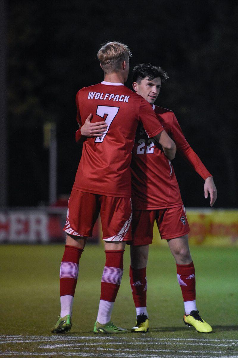 Sophomore defender Jarvis Cleal and graduate midfielder Conor Kelly celebrate during the Wolfpack's home soccer match against the William &amp; Mary Tribe on Tuesday, Oct. 18, 2022 at Dail Soccer Field. The Wolfpack beat the Tribe 2-1.