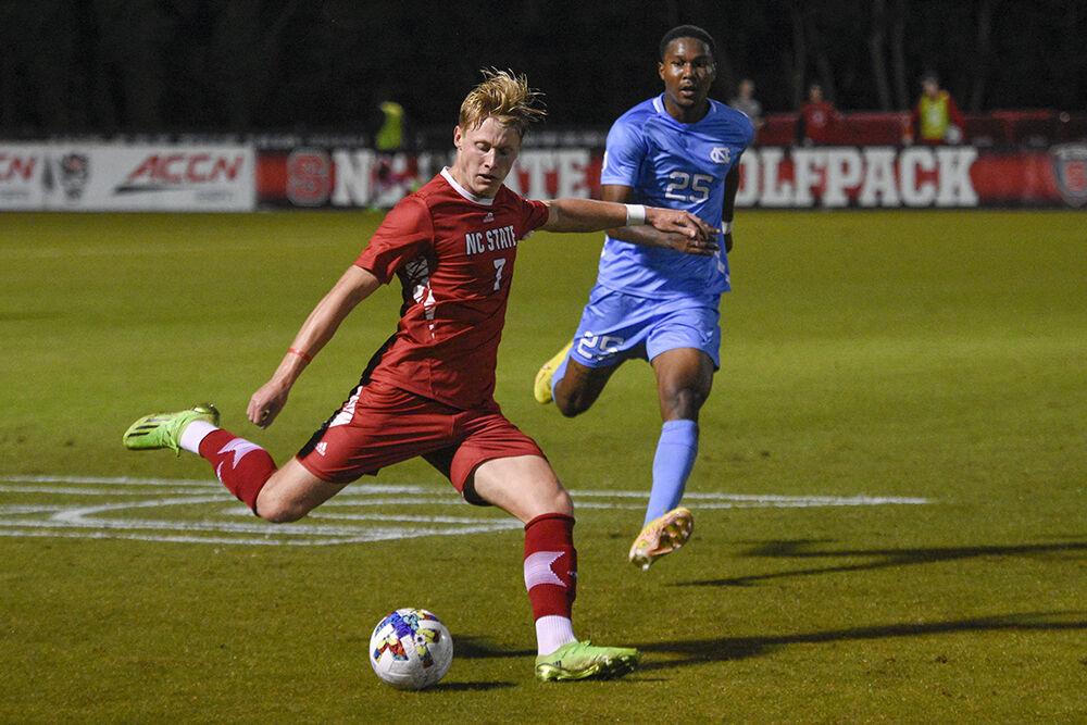 Sophomore defender Jarvis Cleal kicks the ball during the match against UNC-Chapel Hill on Friday, Oct. 14, 2022 at Dail Soccer Field. NC State tied 2-2 with&#160;UNC-Chapel Hill.