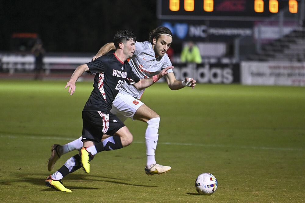 Graduate midfielder Conor Kelly sprints after the ball during the match against Syracuse on Saturday, Oct. 22, 2022 at Dail Soccer Field. NC State tied Syracuse 1-1.
