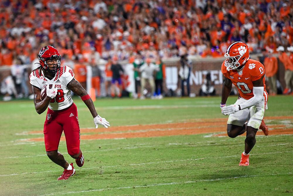 Redshirt junior wide receiver Devin Carter runs with the ball during the game against Clemson on Saturday, Oct. 1, 2022 at Clemson Memorial Stadium. Carter had 54 receiving yards during the game. NC State lost 30-20.