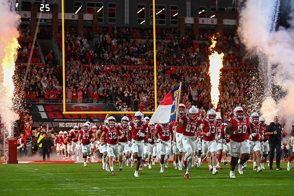 The NC State football team takes the field before the game against Florida State University at Carter-Finley Stadium on Saturday, Oct. 8, 2022. The Wolfpack beat the Seminoles 19-17.
