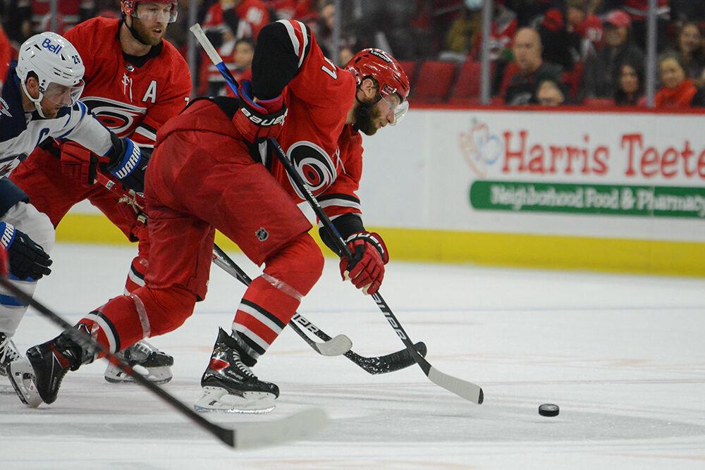 Centerman Jordan Staal evades the Winnipeg defense at center ice during the Hurricanes' home game against the Winnipeg Jets in PNC Arena on Thursday, April 2022. The Canes came from behind to beat the Jets 4-2. Stall scored one goal.