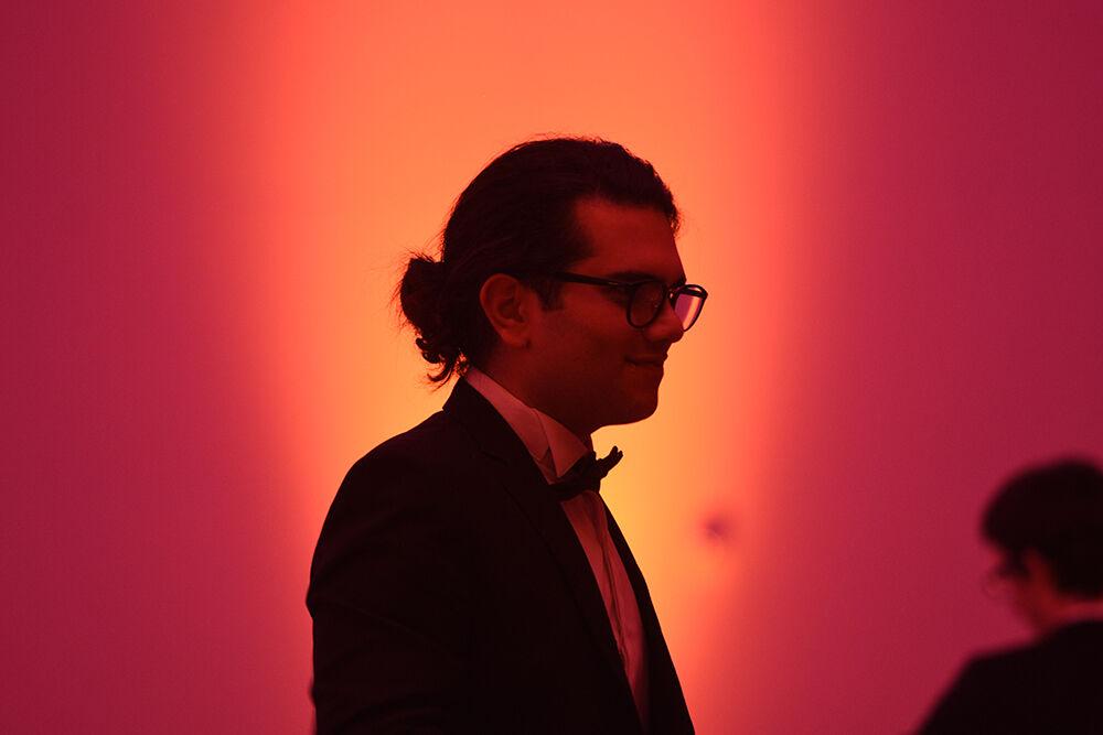 Benyamin Tabarsi, a graduate student studying computer science, listens to music on Saturday, Oct. 22, 2022 at Talley Student Union. Red &amp; White Ball was NC State's annual formal dance and was hosted by the University Activities Board.