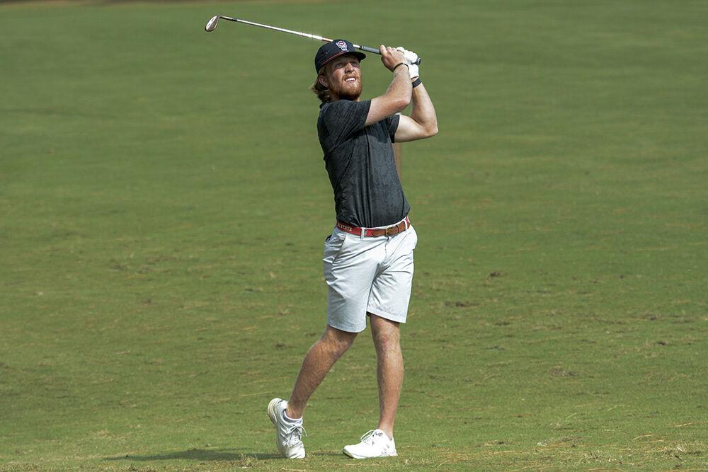 Senior Carter Graf watches his ball fly into the air during the Wolfpack Intercollegiate on Oct. 16, 2022 at Lonnie Poole Golf Course.&#160;Graf finished 14th with an final 54-hole score of 1-under. NC State tied for second overall.&#160;