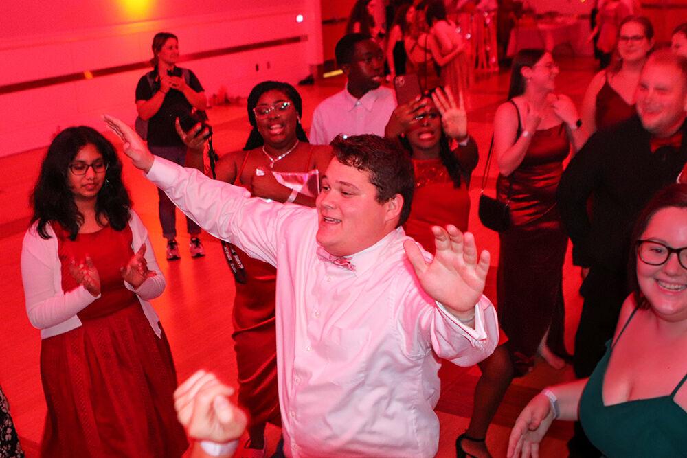 Chandler Smith, a third-year studying business administration, dances with other students at the Red and White Ball in Talley Student Union on Saturday, Oct. 22, 2022.