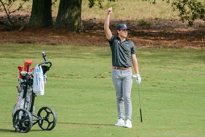 Senior Brandon Einstein gives a thumbs up after hitting the ball during the Wolfpack Intercollegiate on Sunday, Oct. 16, 2022 at Lonnie Poole Golf Course. Einstein tied for 28thwith a final 54-hole score of 5-over. NC State tied for second overall.&#160;