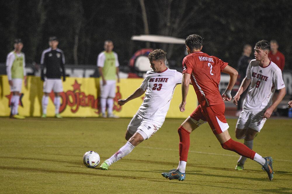 Freshman midfielder Drew Lovelace prepares to shoot the ball during the match against Radford on Tuesday, October 25, 2022 at Dail Soccer Field. NC State defeated Radford 2-0 in the last home game in the regular season.