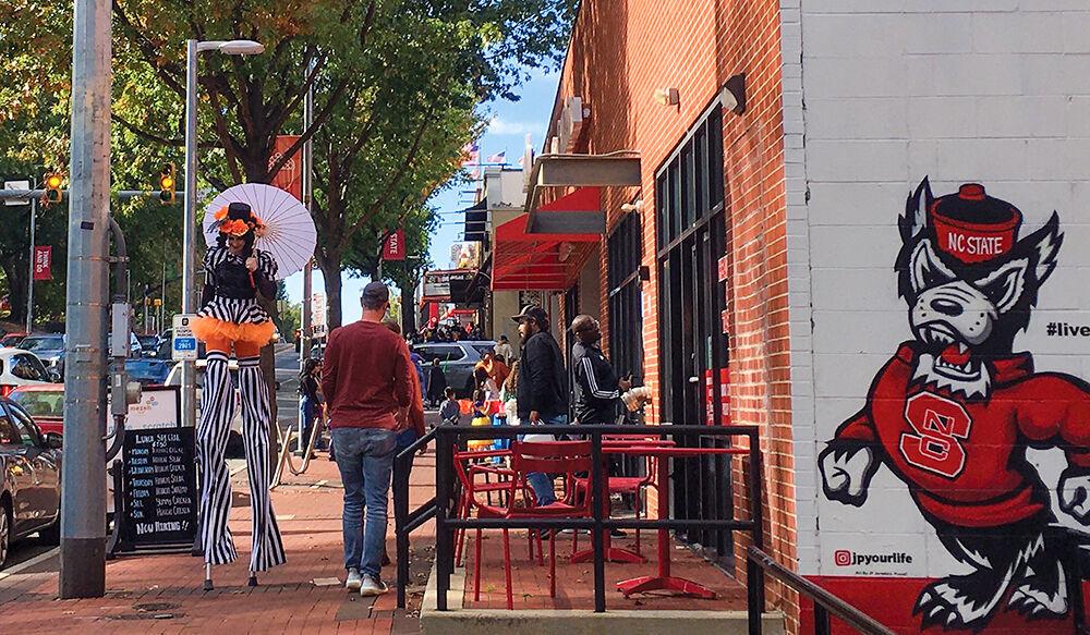 Hillsborough Street hosts trick-or-treating superheroes, dinosaurs and more