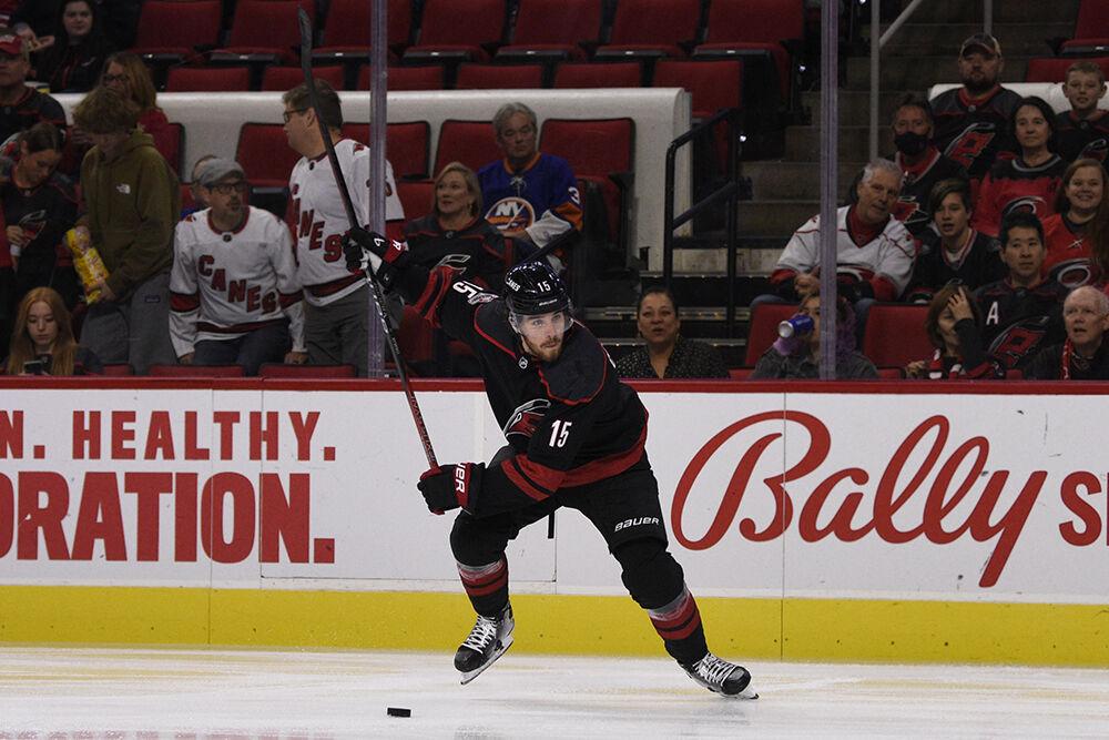Defenseman Dylan Coghlan prepares to take a shot on goal during the game against the New York Islanders in PNC Arena on Friday, Oct. 28, 2022. Coghlan had four shots. The Hurricanes lost 6-2.