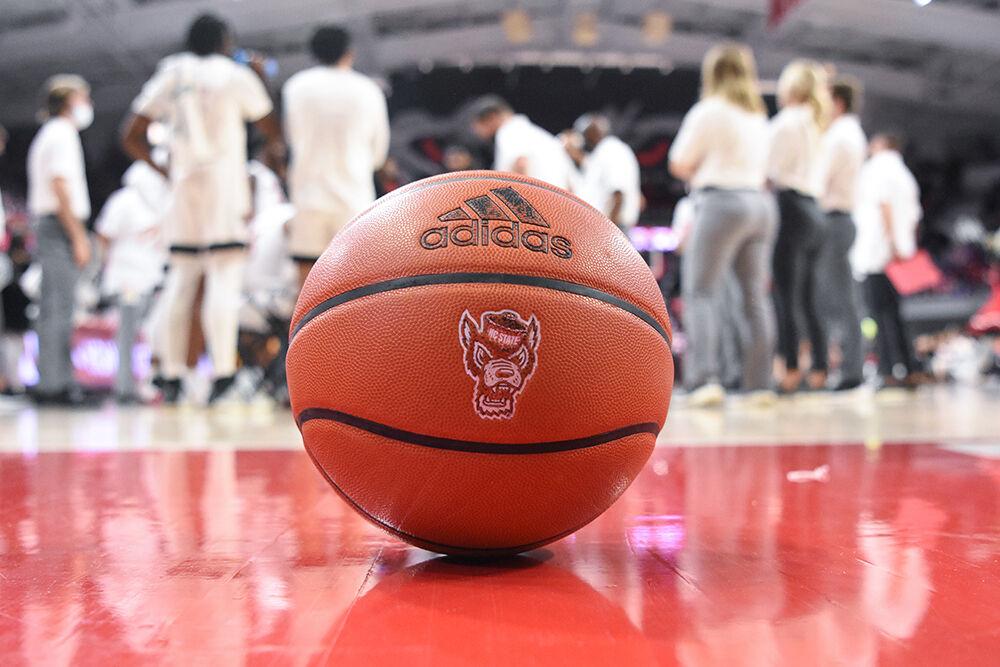 A basketball sits in James T. Valvano Arena at Reynolds Coliseum on Thursday, Dec. 9, 2021. This was during the annual Heritage Game at Reynolds. The Wolfpack won 65-48.